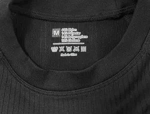 Close-up of thermal base layer collar showing size M label and fabric composition detail