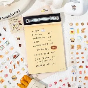 Flat lay of minimalist food theme journal stickers with hand-drawn coffee and dessert motifs