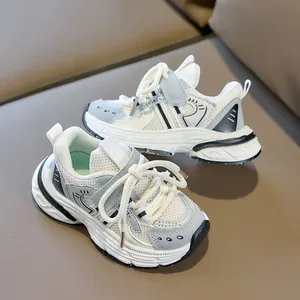 Detail of breathable mesh upper and hook-and-loop closure on children's sport shoes