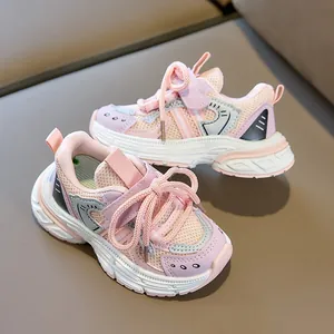 Detail of pink breathable mesh kids sneakers with secure velcro strap and sport logo