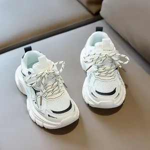 Detailed close-up of white mesh kids sneakers featuring breathable fabric and leather paneling
