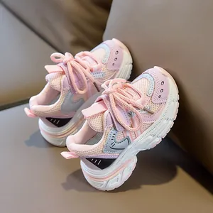 Detail of pink and grey breathable mesh girls sneakers with cushioned non-slip soles