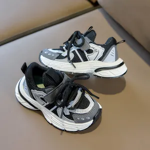 Detail of breathable mesh upper and hook-and-loop strap on kids athletic sneakers