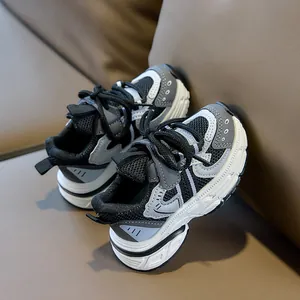 Close-up of breathable mesh and synthetic leather upper on kids' sports sneakers