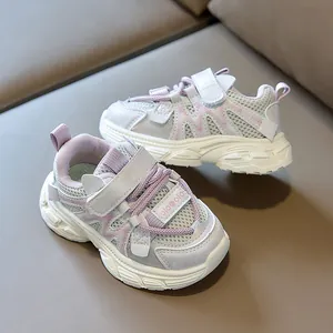 Detail view of purple mesh breathable upper and Velcro closure on kids sports shoes