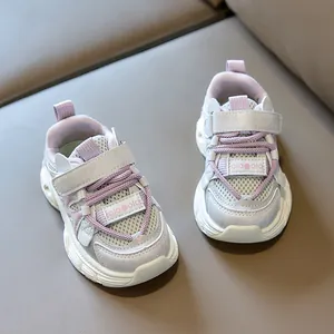 Top view of breathable mesh kids sneakers with lavender laces and velcro closure