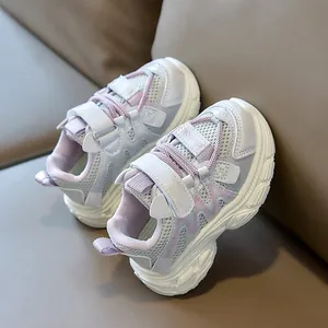 Macro view of light purple breathable mesh and cat ear detail on kids sneaker shoe