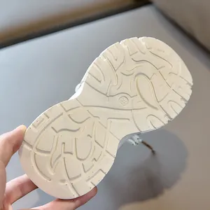 Detail view of anti-slip wavy texture and size 28 engraving on kids shoe sole