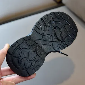 Detail showing the non-slip rubber sole with geometric patterns and size 28 marking