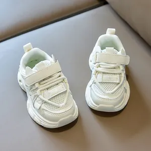 Macro detail of breathable mesh fabric and velcro strap on cream kids sneakers