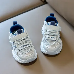 Detailed view of breathable mesh kids' sneakers with hook and loop closure system