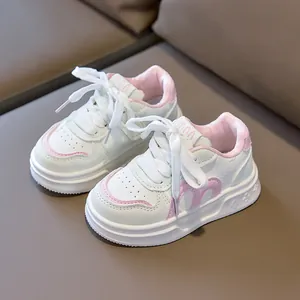 Pink and white children's fashion sneakers with soft soles and velcro sport design