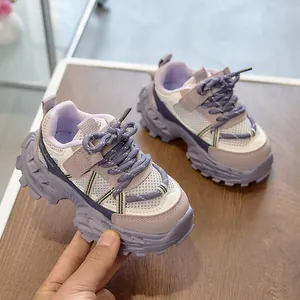 Detail of purple and white kids chunky sneakers featuring breathable mesh and grip soles