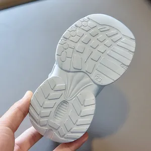 Close-up of lightweight kids' sneaker outsole with size 23 and non-slip tread