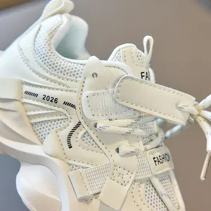 Detail of children's breathable mesh sneakers with velcro strap and 2026 print