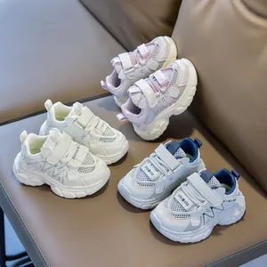 Detailed close-up of kids mesh sneakers showing hook-and-loop closure and wave textures