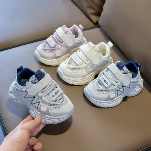 Close-up showing pink, white, and navy breathable mesh sneakers for kids with velcro straps