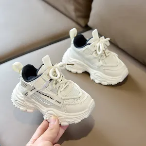 Detail of children's mesh sneakers showing breathable fabric and side pattern