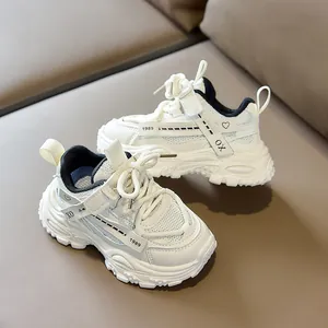 Detail of kids sporty sneakers featuring mesh upper, velcro closure and 1989 graphic