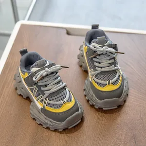 Top view of kids' sports shoes with breathable mesh and anti-slip thick rubber soles