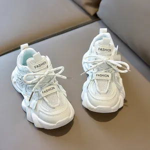 Detail view of children's chunky sneaker showing breathable mesh and fashion text
