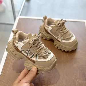 Close-up of chunky non-slip rubber sole and breathable mesh on children dad sneakers