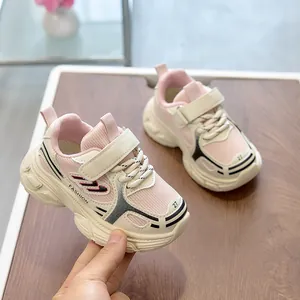 Detail showing pink and beige kids' mesh sneaker with velcro strap and chunky non-slip sole
