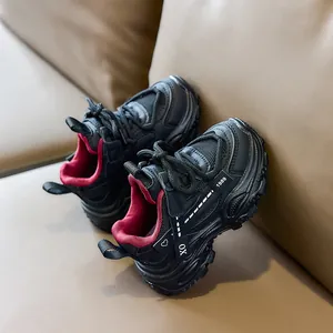 Detail of children's mesh sneakers with non-slip thick sole and 1989 graphic print