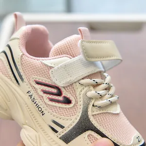 Detail of pink and beige kids' sneaker with breathable mesh and velcro strap closure