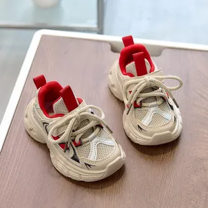 Top-down view of kids' chunky sneakers with breathable beige mesh and soft rubber soles
