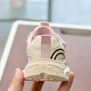 Close-up of pink breathable mesh kids sneakers with non-slip thick rubber soles