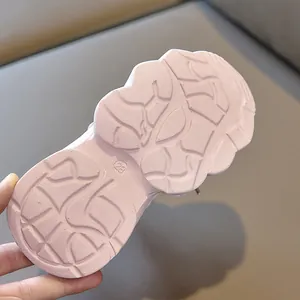 Close-up of pink non-slip outsole with deep traction patterns on children's shoes
