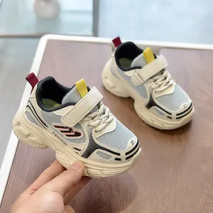 Detailed close-up of breathable mesh kids sneakers with secure velcro strap and soft sole