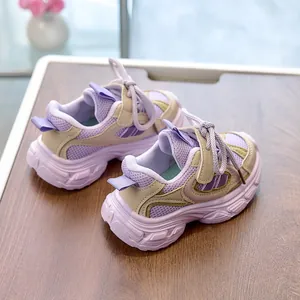 Close-up of kids lavender and beige chunky sneakers with breathable mesh and thick soles