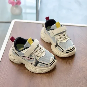 Breathable mesh kids' sneakers in beige and blue with chunky non-slip rubber soles