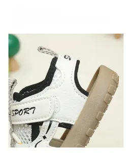 Detail view of toddler sport sandals featuring white breathable mesh and ankle velcro straps