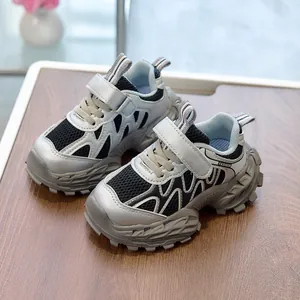 Detail of kids breathable mesh sneaker with Velcro strap and thick non-slip silver sole