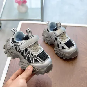 Detail of kids breathable mesh sneaker with velcro strap and fashion lettering