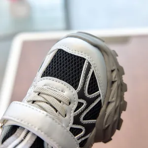 Macro shot of breathable mesh and durable toe cap on children's athletic running shoes