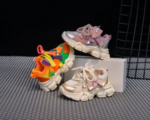 Close-up of children's chunky sneakers in multiple vibrant colors with breathable mesh