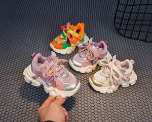 Detail view of colorful kids chunky sneakers with mesh upper and durable rubber soles