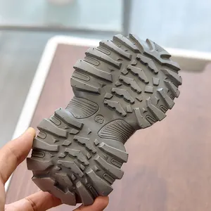 Detailed view of durable rubber outsole with anti-slip tread patterns for kids sneakers