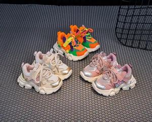 Detailed top view of breathable kids' sneakers in three vibrant color combinations