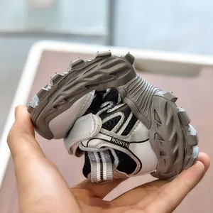 Detail showing high flexibility of the kids athletic shoe with non-slip rubber sole