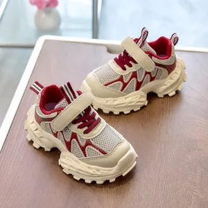 Top view of kids running shoes with cream mesh and burgundy synthetic leather panels
