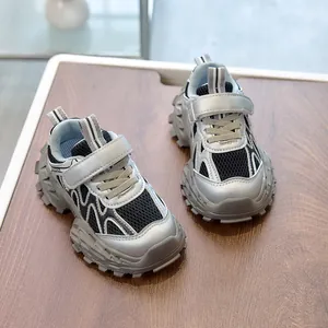Detail view of children sports shoes with breathable mesh and anti-slip thick soles