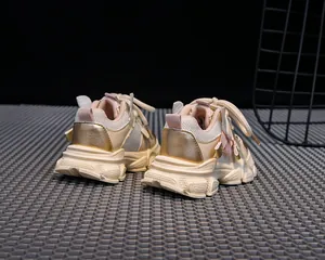 Detailed side view of kids chunky sneakers featuring breathable mesh and gold accents