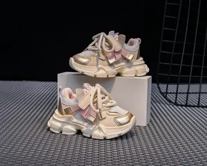 Detail view of children's thick sole chunky sneaker with mesh and synthetic leather paneling