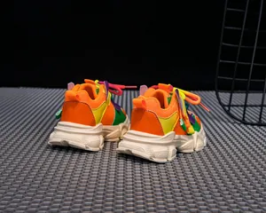 Detail of vibrant mesh upper and durable thick sole on colorful girl's fashion sneakers