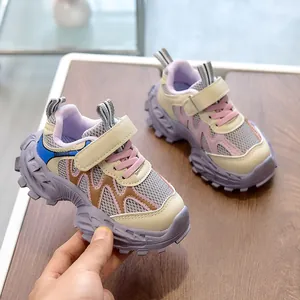 Detail of multi-color children's sneaker showing breathable mesh and non-slip rubber sole